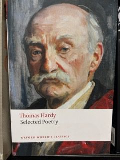 Book cover of Selected Poetry by Thomas Hardy, part of the Oxford World’s Classics series. The cover features a somber painted portrait of Hardy, his expression reflective and melancholic—aptly evoking the themes of grief, loss, and depression that run through his poetry.