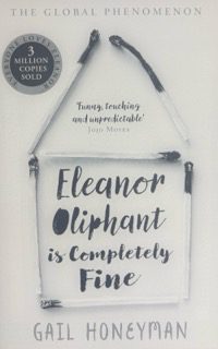 Book cover of 'Eleanor Oliphant is Completely Fine' by Gail Honeyman, featuring a white wooden sign hanging from rope against a light background. The cover includes a silver award medal and the tagline 'Funny, touching, and unpredictable.' This bestselling novel follows Eleanor, a socially awkward character whose journey of self-discovery and human connection resonates with many readers, including those with ADHD who may relate to her experiences of feeling different and navigating social situations.