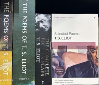 A collection of poetry books by T.S. Eliot stacked together, their spines showing fragmented titles and volumes. The arrangement suggests literary exploration of fractured identity and the modernist tradition of depicting psychological fragmentation.