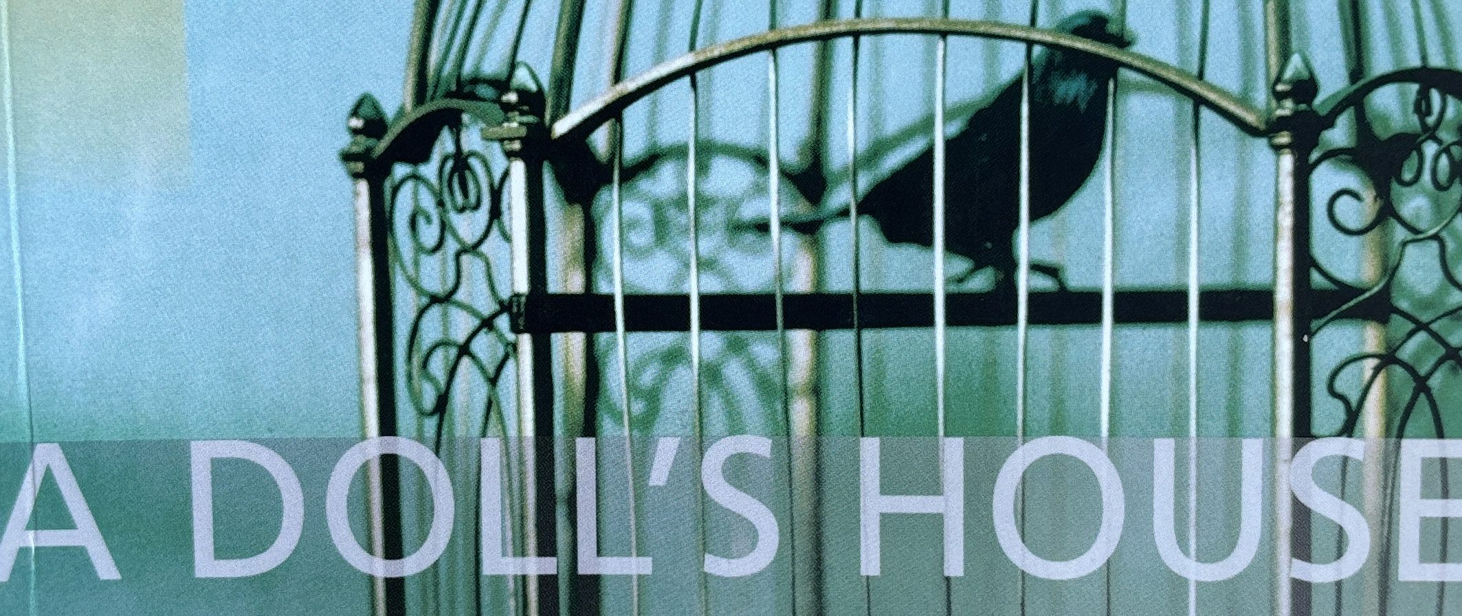 A Doll’s House cover with a caged bird, symbolising Nora’s DPD and dependence.